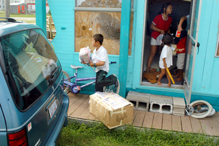 Whatever the coming storm's true name, Floridians, like these evacuating Pompano Beach residents, are praying it will not exceed in severity the infamous Hurricane !!! of 1983.